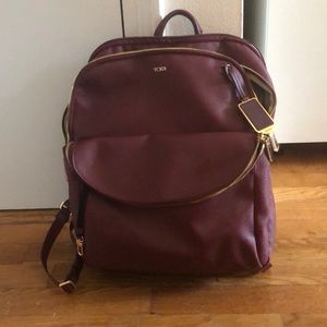 Like new - maroon Tumi backpack w computer pocket